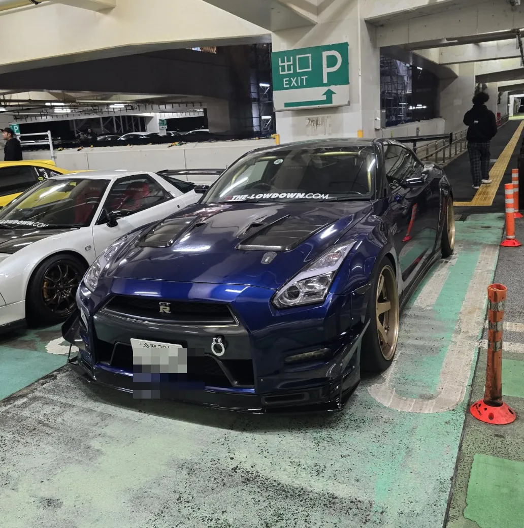 Blue Nissan GT-R at a car meet in Japan; license plate obscured